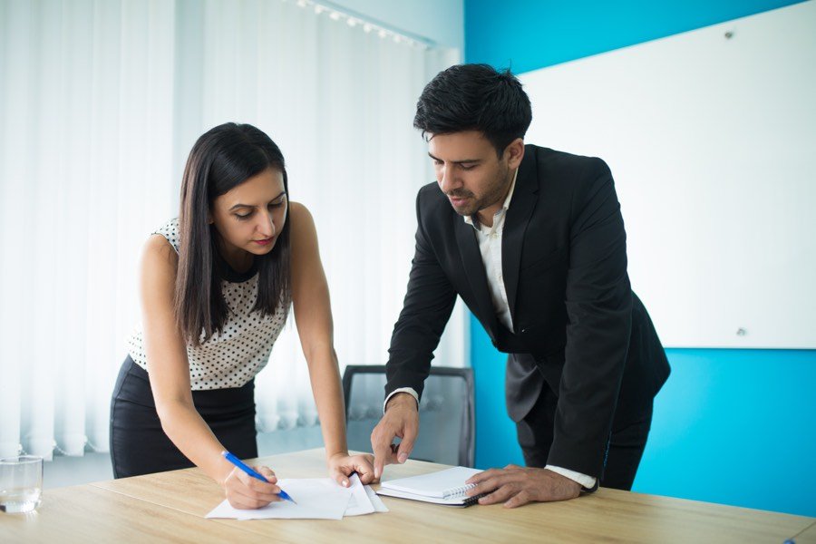 Company directors signing a contract