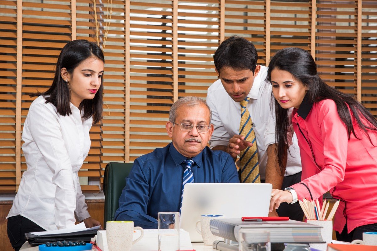 An Indian advisor closing a policy with a client