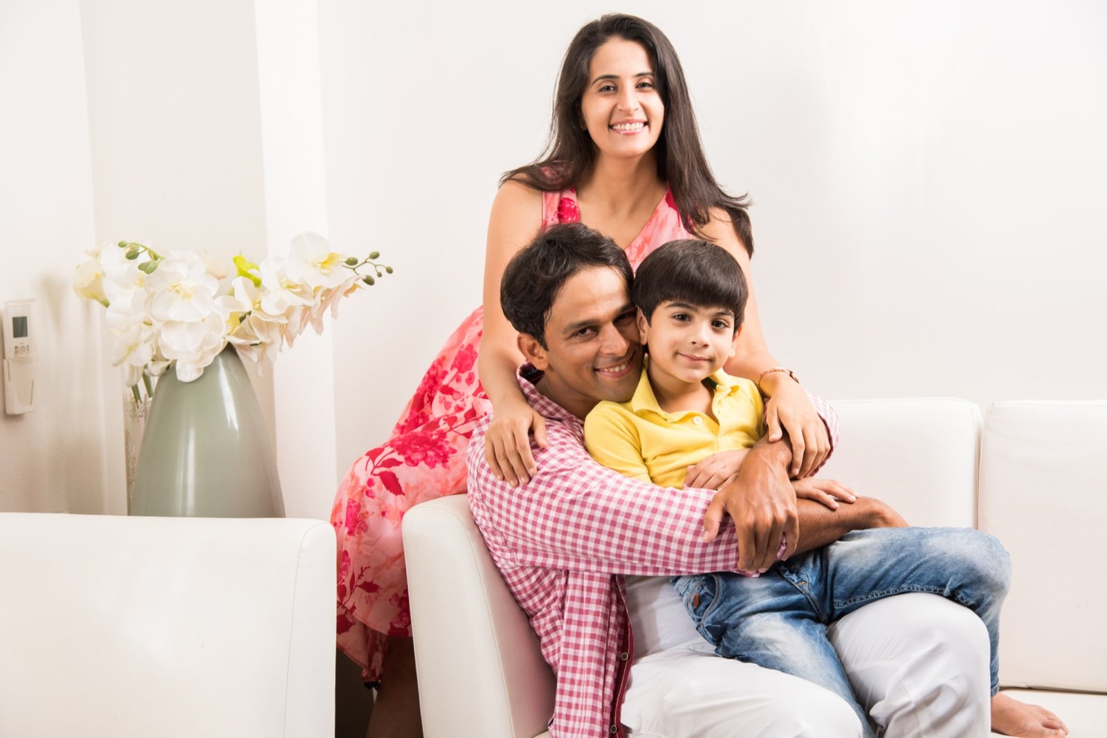 An Indian family at home, protected by the right cover
