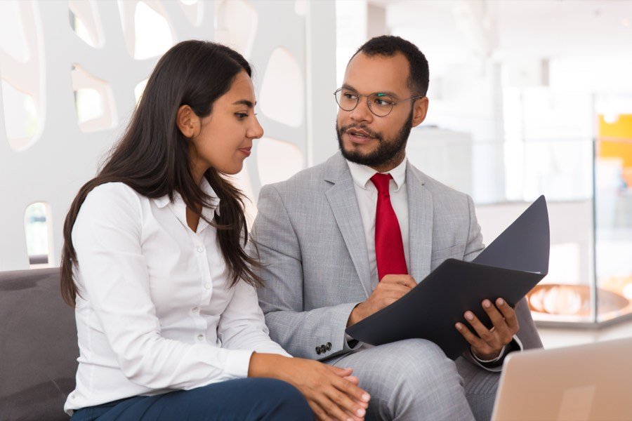 A consultant explaining documents to a client