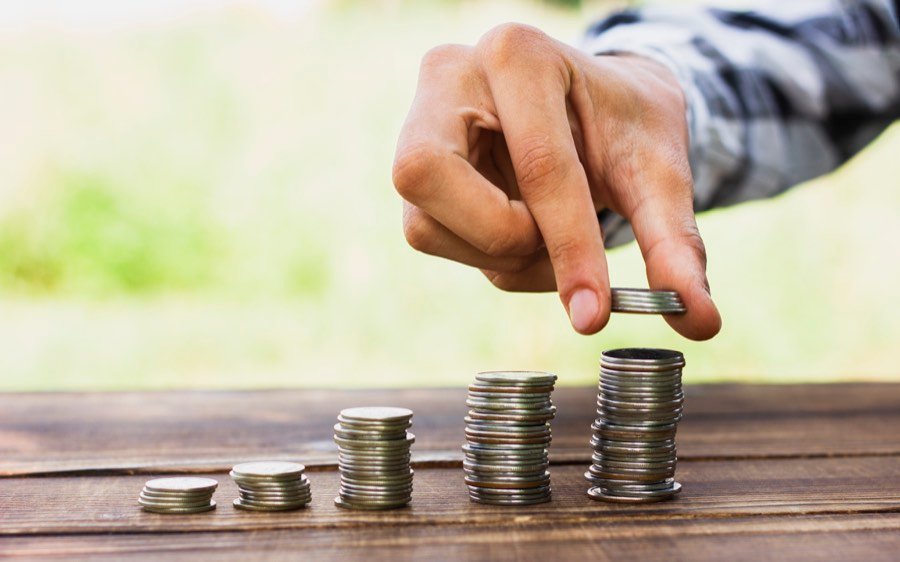 Coins balanced on a scale