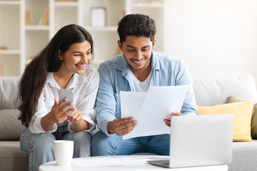 A young Indian couple reviewing their ELSS options
