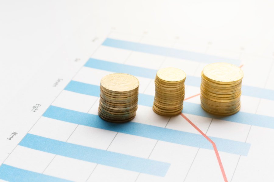Coin stacks arranged over a printed graph