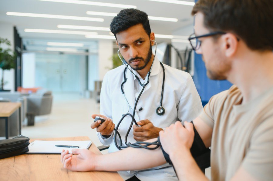An Indian doctor checking a patient after an accident